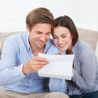A Couple review their quote for a heat pump